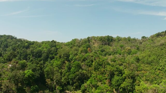 Aerial view Drone fly over Patong city with mountains in the foreground,Patong bay Phuket Thailand,Beautiful sea nature background