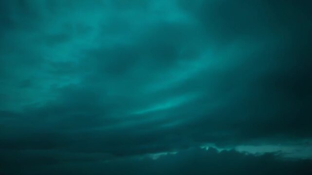 Soft ethereal clouds diffuse light across a tranquil gradient sky, shifting from light mint to deep turquoise, creating a calming, dreamy backdrop with gentle texture