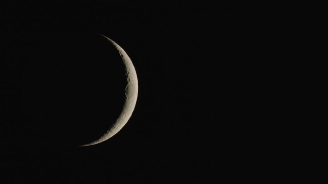 Waning crescent Lunar phase, the final phase of the lunar cycle. The thin, shrinking slivery in the black sky.