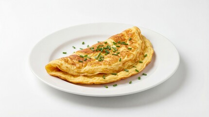 Fototapeta premium Classic fluffy French omelette perfectly folded and garnished with fresh green chives on a plate