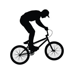 Obraz premium Silhouette of a cyclist performing a trick on a bmx bike