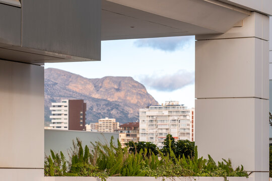 Architecture frame with minimalism view to cityscape and mountains near Benidorm Spain creating copy space for real estate and tourism concepts