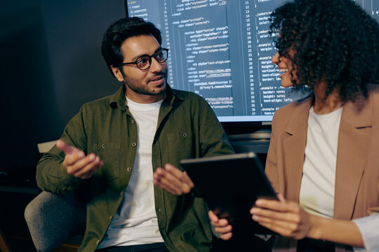 developers debug and refine together, team collaboratively analyzing and improving software code