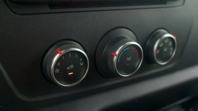 Knob climate control, Rotary dial for air setting, Cabin comfort feature with adjustable climate control knob, Tactile feedback rotary switch for temperature regulation in vehicle cabin