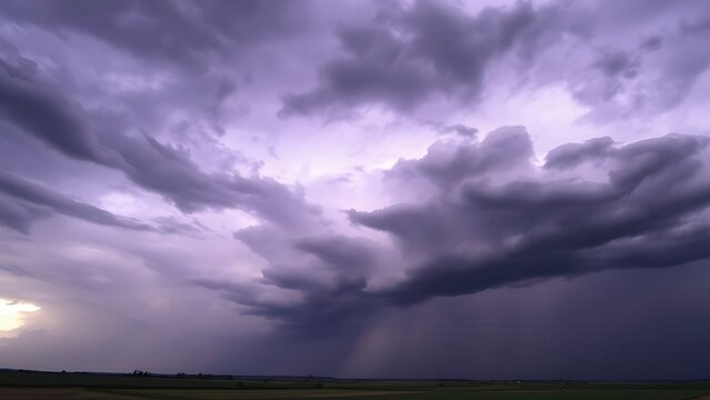 Dark purple storm clouds gathering before rainfall, dramatic sky formation, natural weather phenomenon. 