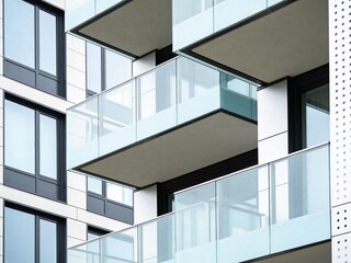 Fototapeta premium A modern building with glass balconies and sleek architecture design