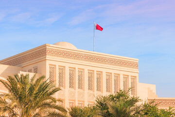Bahrain flag waving above the government building in Manama