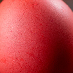 Extreme macro of naturally dyed red Easter eggshell texture
