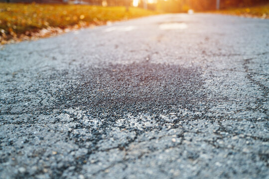 Gritty asphalt patch on empty roadway