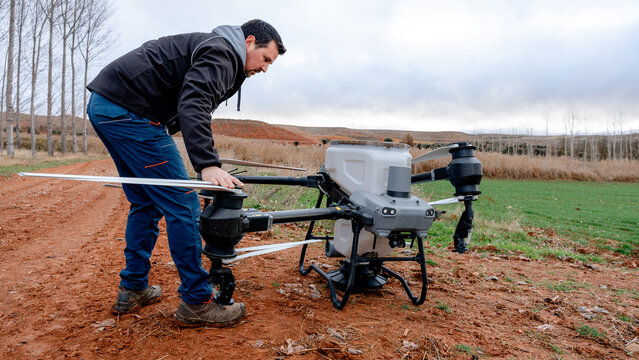 Agricultural drone preparation in wheat field