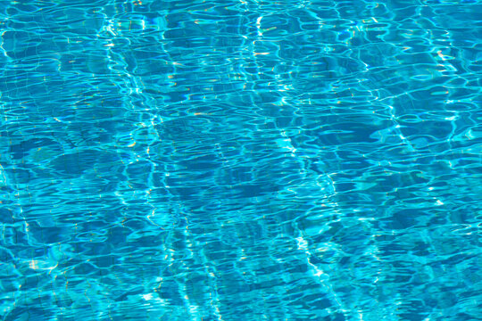 Rippling reflections on a blue water surface