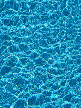 Blue water ripple pattern under sunlight
