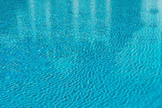 Tranquil blue water ripples in sunlight