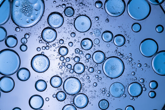 Macro view of blue bubbles on liquid surface