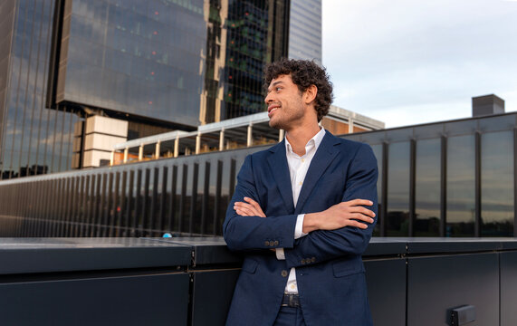 Confident businessman in suit at modern urban location
