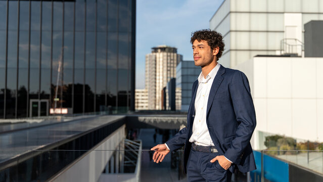 Confident professional standing outside modern office