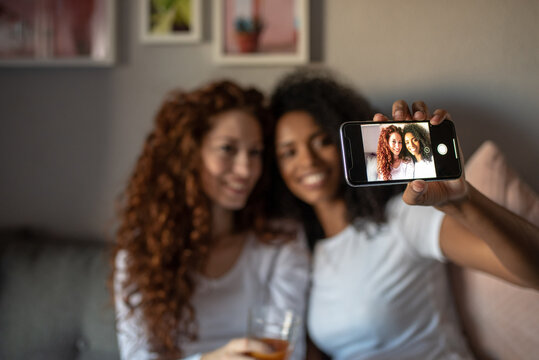 Happy couple taking a selfie at home