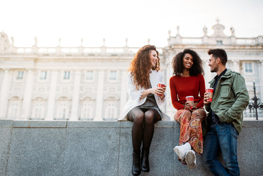 Friends enjoying coffee in Madrid