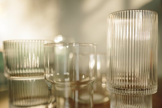 Elegant glassware set with sunlight reflections