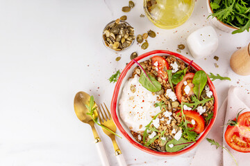Savoury granola and yogurt breakfast bowl, balanced morning snack with greek yoghurt, tasty salted...