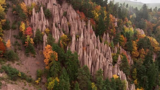 Earth pyramids of Platten at daytime, aerial view, at autumn season time.