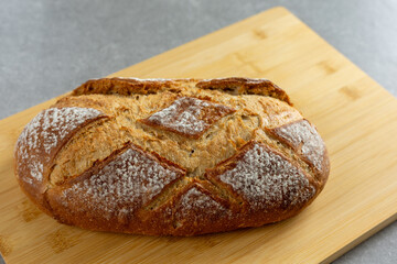 rustic sourdough bread on cutting board