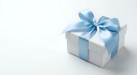 Obraz premium White gift box with elegant blue satin ribbon and bow on clean background for celebrations, holidays, birthdays, and special occasions.
