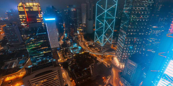 A dramatic illuminated cityscape showcases Hong Kong Central's