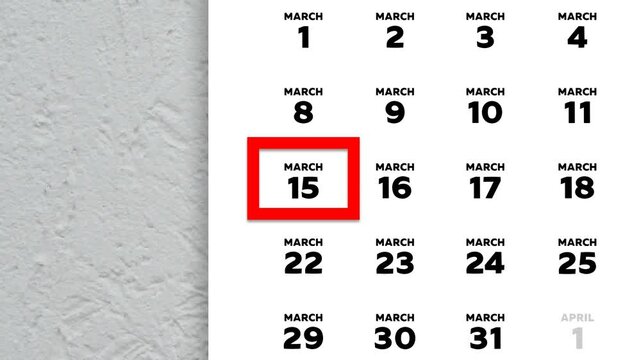 The date March 17th marked with a red cursor on the wall calendar 2026