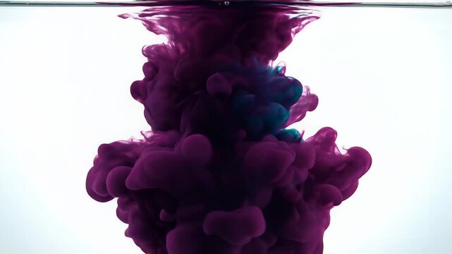 Purple ink cloud diffusing in clear water for abstract background