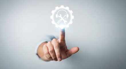 A hand interacting with a glowing gear icon on a gray background with a futuristic feel