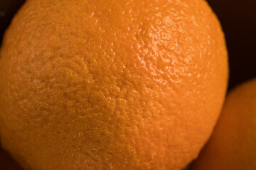 Macro close-up of Dekopon (Shiranui) orange peel showing detailed natural citrus texture and vibrant surface. Ideal for food backgrounds, citrus concepts, and fresh fruit visuals.