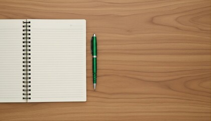 Open spiral notebook with green pen on wooden desk top view with copy space