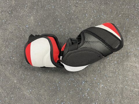 hockey arm guard on the gray background