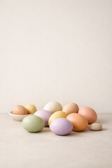 Minimal pastel Easter eggs arranged on neutral background, soft spring holiday concept with copy space.