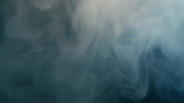 Foggy mist swirling over a dark landscape viewed from a high vantage point