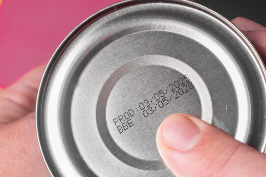 A close-up of the expiration date and production date on a metal can