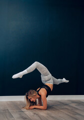 Obraz premium Portrait Of Beautiful Young Female Doing Stretching, Girl Exercising and Enjoying Fitness Training And Healthy Lifestyle. Yoga for healt.