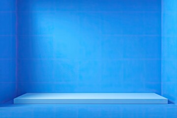 Empty blue box room with a platform, illuminated by soft lighting. The walls have grid lines