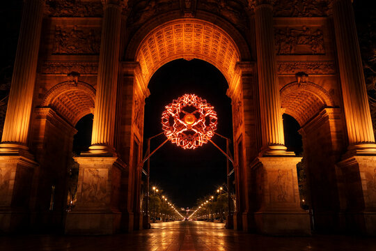 Milan, Italy - February 17, 2026: Night view of the Arco della Pace (Arch of Peace) in Milan, Italy, illuminated by a large spherical light installation symbolizing the Olympic flame.