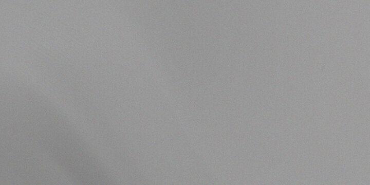 Abstract gray textured background with subtle noise and grain effect