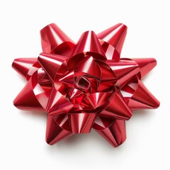 Red gift bow made of a shiny ribbon is lying on a white background