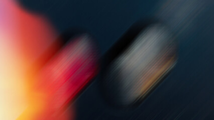 Abstract blurred gradient background with glowing yellow and red spots on dark atmosphere.