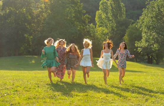 Group of smiling happy women enjoying a beautiful day in a park in Stuttgart