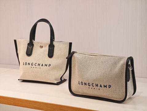 Paris,France-Oct.5th 2025: close up two beige Longchamp canvas handbags