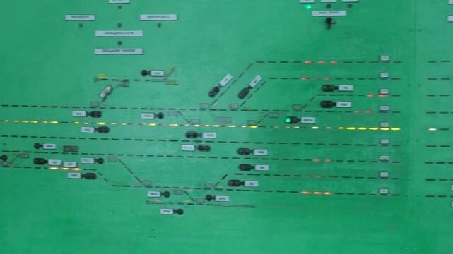 A complex railway traffic control panel with various switches and buttons.