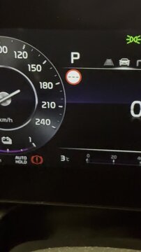 digital dashboard of electric car with range and driven mileage