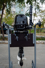 Outboard motor on a transport trolley.