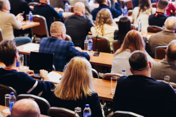 Conference, hall with audience, panel discussion at forum, people on a congress together listen to speaker on stage at convention, plenary session at business lecture seminar, venue for presentation