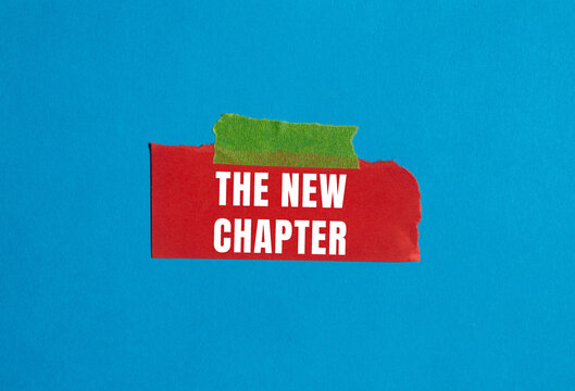 The new chapter message written on ripped torn paper background. Conceptual The new chapter symbol. Copy space.